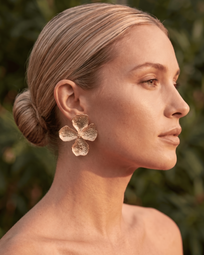 A pair of DIDI Gold Earrings by AUKA STUDIO, featuring elegant gold jewelry with intricate design details.