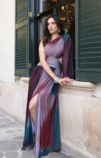 Auka Studio Romina Dress, elegant sleeveless vestido with a flowing silhouette and floral pattern, showcased on a model.