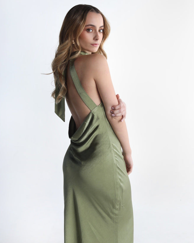 Auka Studio Kate Green Dress, sleeveless stylish dress with a fitted silhouette, displayed on a hanger.