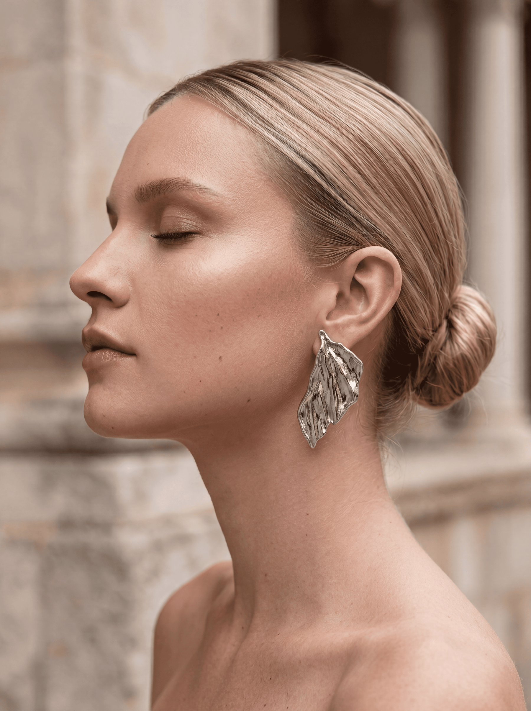 Silver Jane earrings from Auka Studio, showcasing elegant, minimalist jewelry design with polished silver finish.