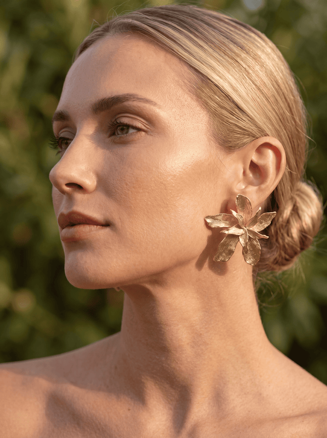 Gold WUT earrings from AUKA STUDIO jewelry collection, featuring sleek, modern design with polished finish.